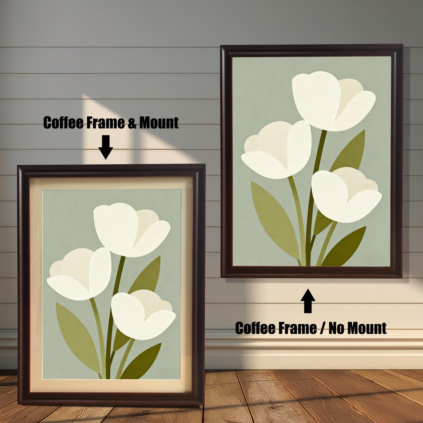 A framed art print of three white tulips is shown in two styles against a wooden wall. One has a coffee-colored frame with a white mount, the other is a larger size with the same frame, but no mount.