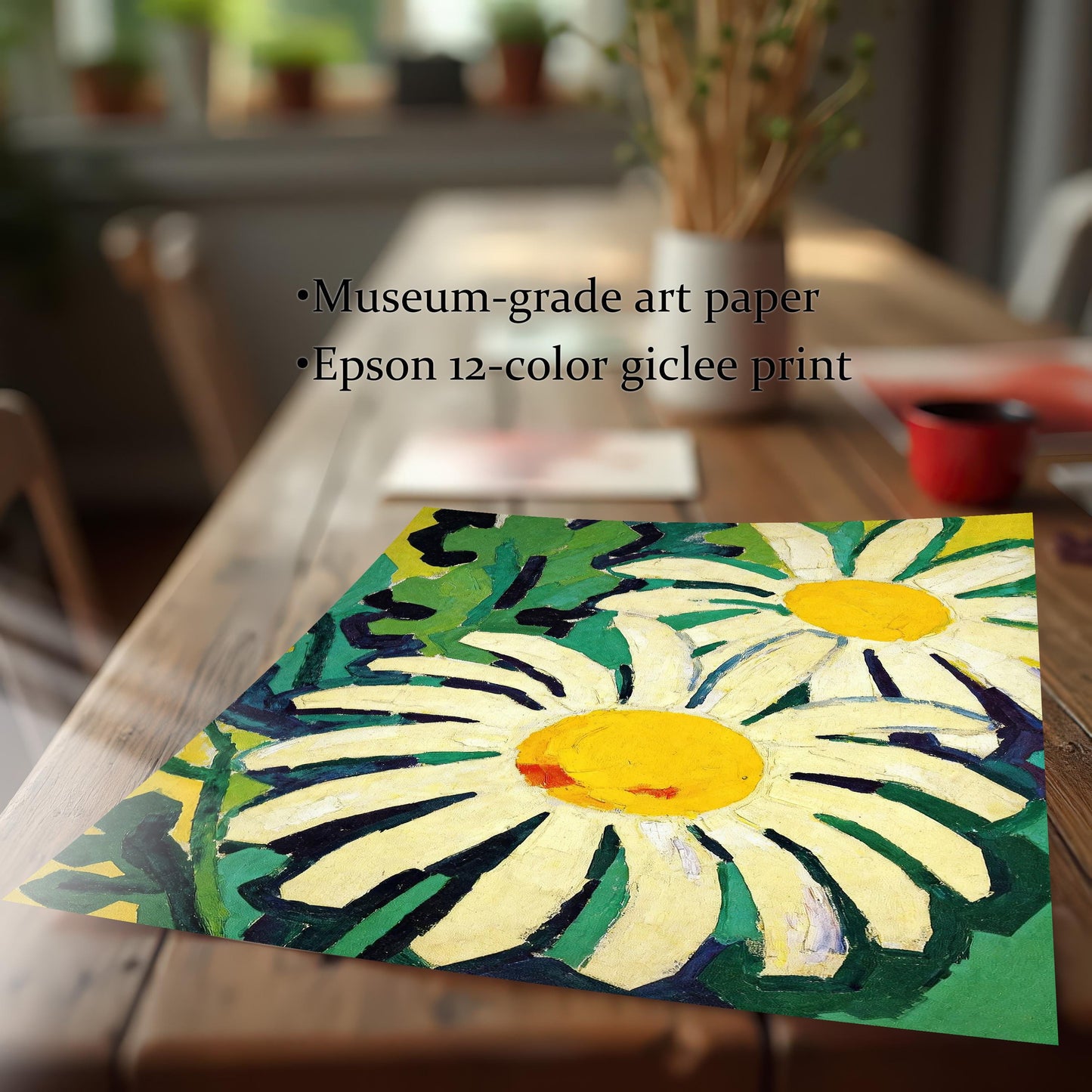A close-up shot of a paper art print of two daisies lying on a wooden table. Text states the print is on museum-grade art paper using an Epson 12-color giclee process.