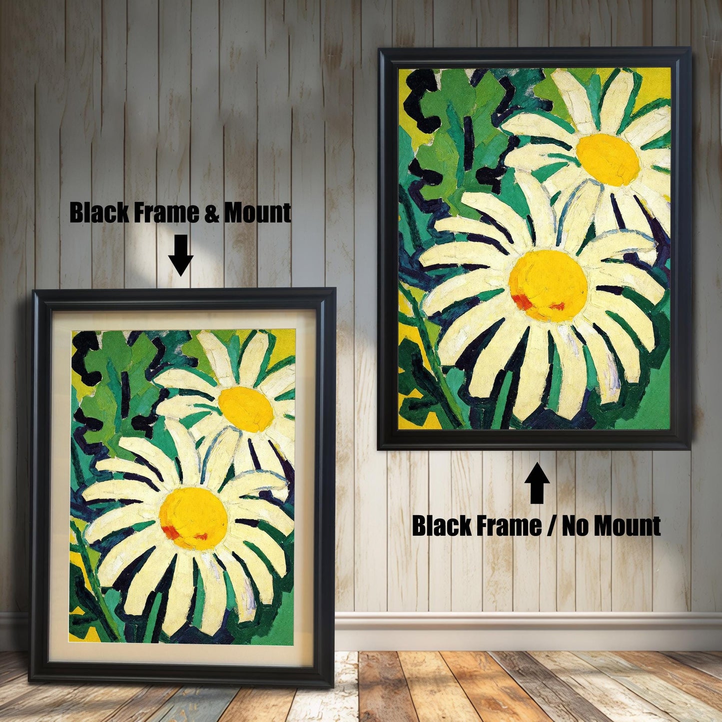 A framed painting of two daisies is shown in two styles against a wooden wall. One has a black frame with a white mount, the other is a larger size with the same frame, but no mount.