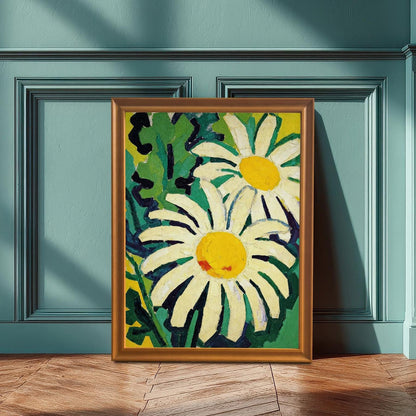 A framed painting of two daisies in a lush, green and yellow background. The art leans against a teal-colored wainscot wall and wooden floor, illuminated by a sunlit window.