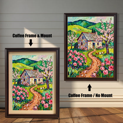 A side-by-side comparison of two coffee-framed prints of a vibrant cottage painting. The smaller one on the left has a mount (matting), while the larger one on the right has no mount.
