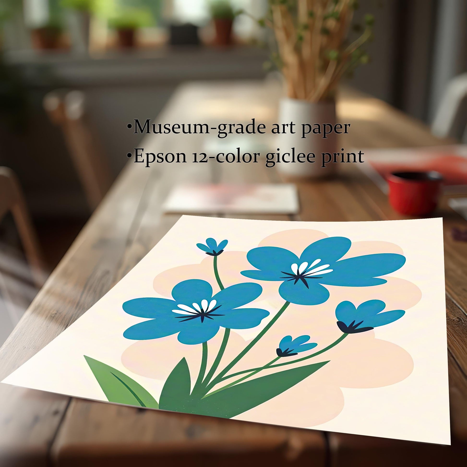 A close-up, angled view of an unframed art print of blue flowers lying on a wooden table. Text overlay highlights "Museum-grade art paper" and "Epson 12-color giclee print."