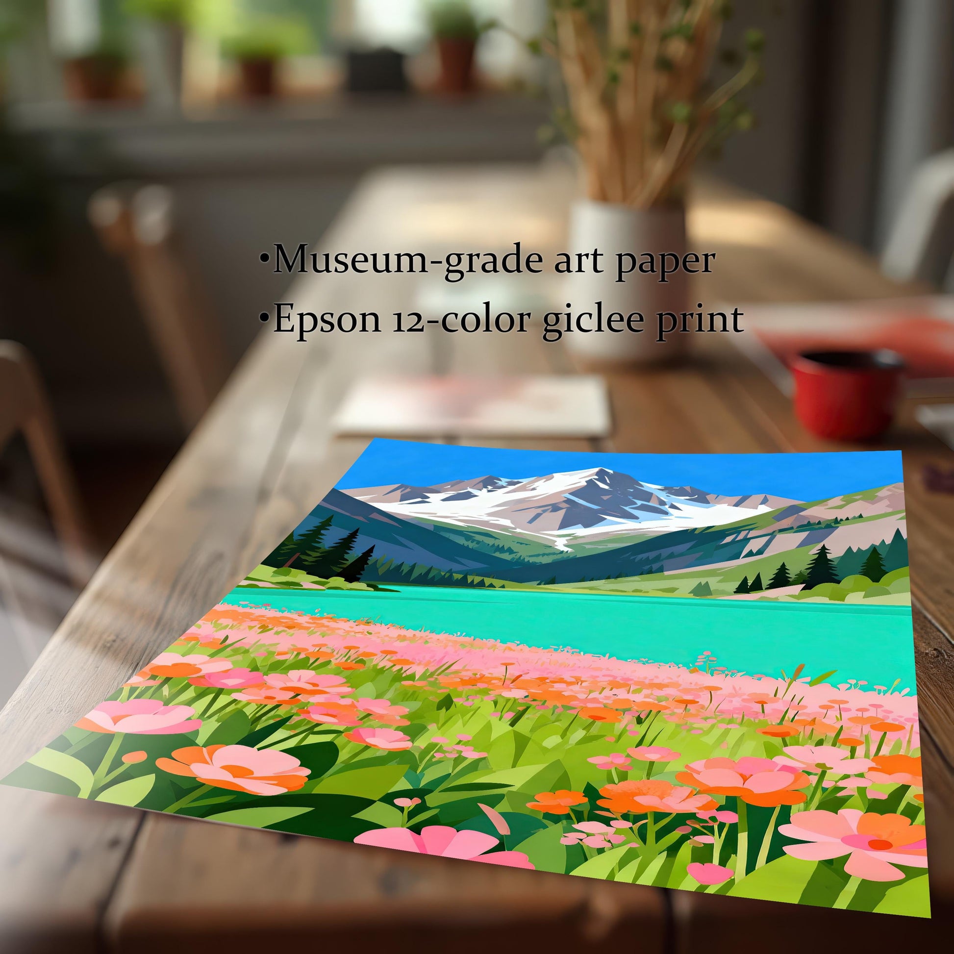 A close-up, angled view of an unframed art print of a mountain and lake scene lying on a wooden table. Text overlay highlights "Museum-grade art paper" and "Epson 12-color giclee print."