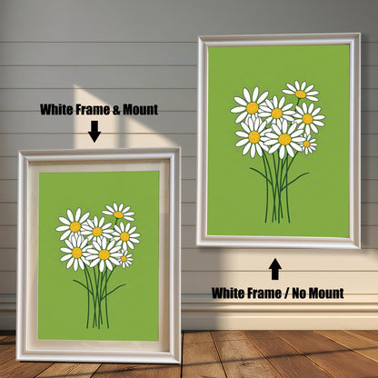 Two framed prints of a bunch of daisies on a green background. The left print has a white frame with a mount, and the right has the same frame without a mount.