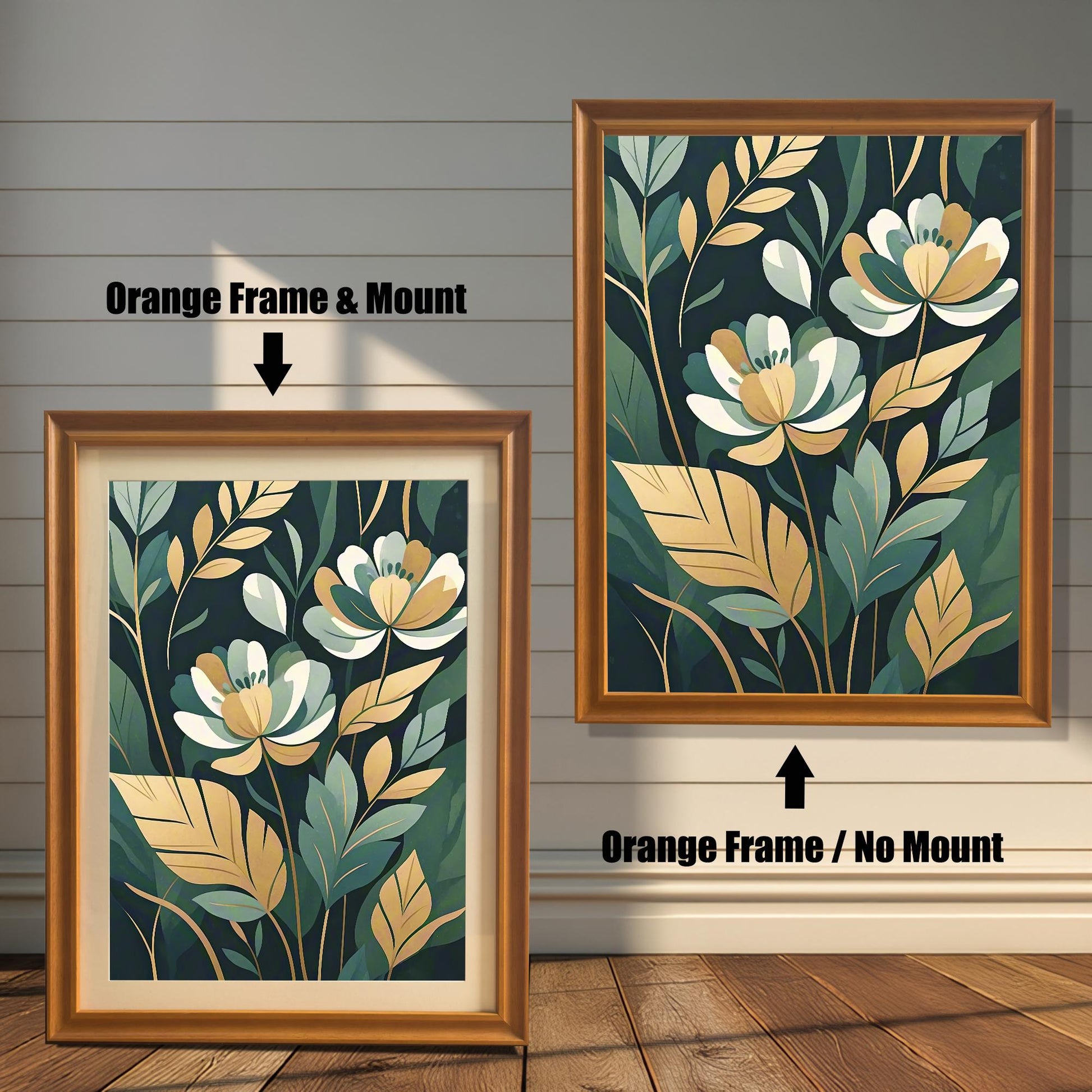 Two framed prints of white and gold flowers. The print on the left has an orange frame with a mount, and the one on the right has an orange frame with no mount.