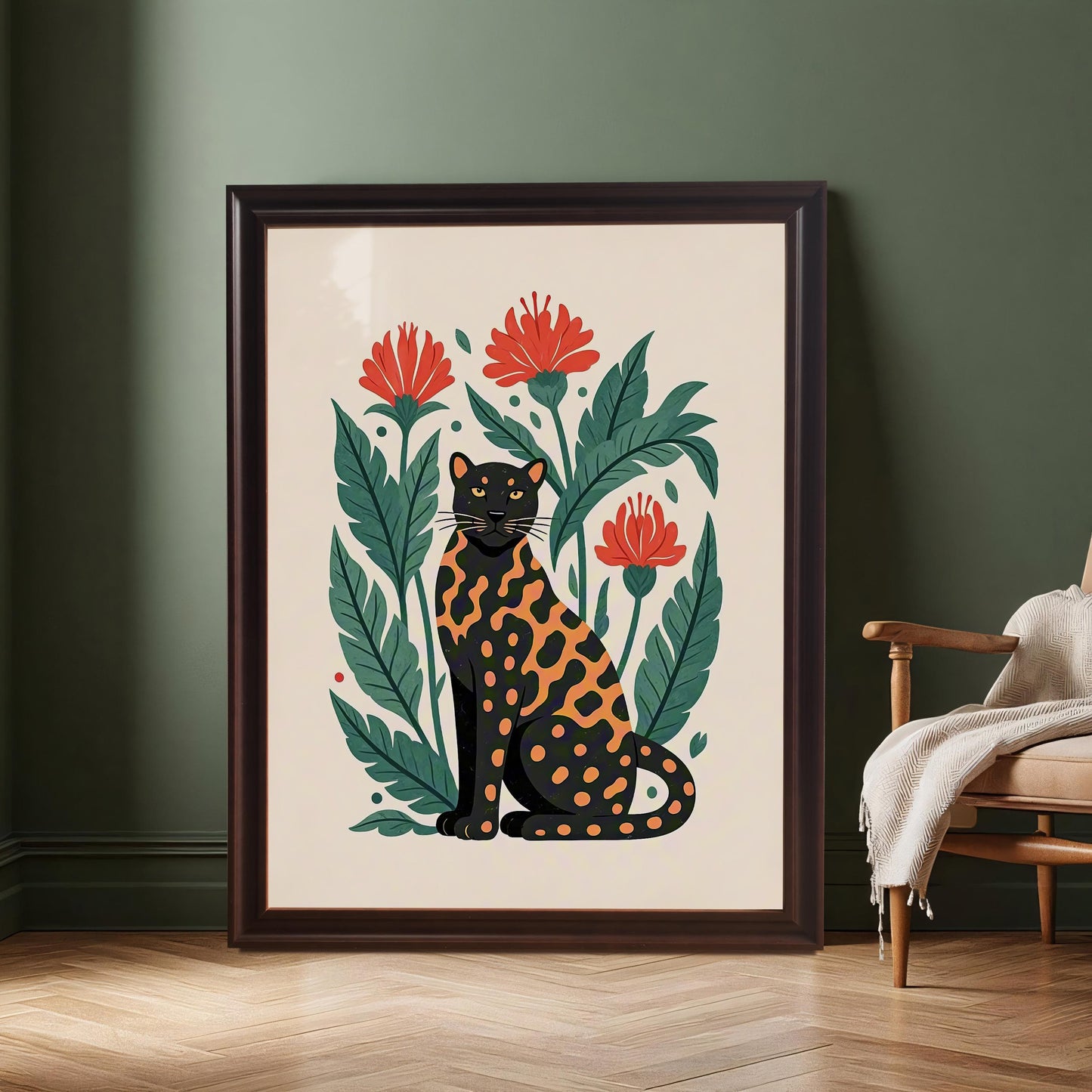 A large framed print of a black and orange spotted leopard surrounded by red flowers and green leaves, leaning against a dark green wall next to a wooden chair with a white blanket.