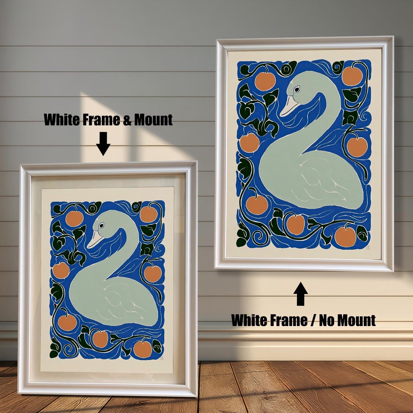 Two framed prints of the swan artwork against a white wooden plank wall. The print on the left is a White Frame & Mount, showing the white border. The print on the right is a White Frame / No Mount.