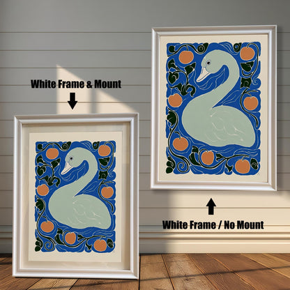 Two framed prints of the swan artwork against a white wooden plank wall. The print on the left is a White Frame & Mount, showing the white border. The print on the right is a White Frame / No Mount.