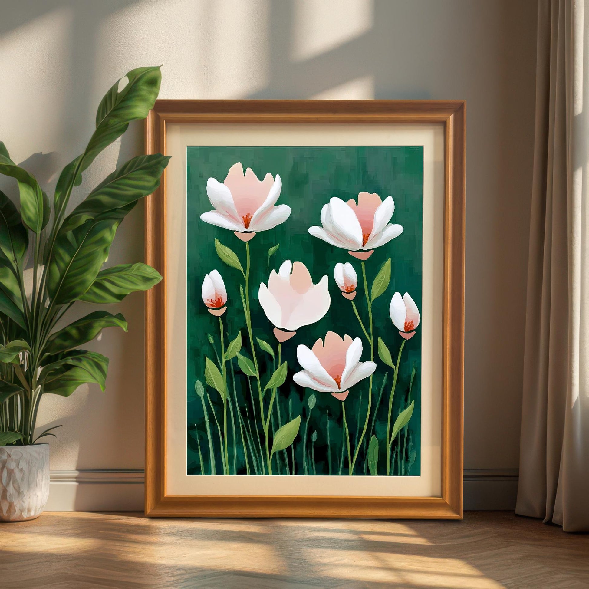 The framed floral art is in a golden-brown (Orange) frame, standing on a wooden floor next to a large potted green plant.
