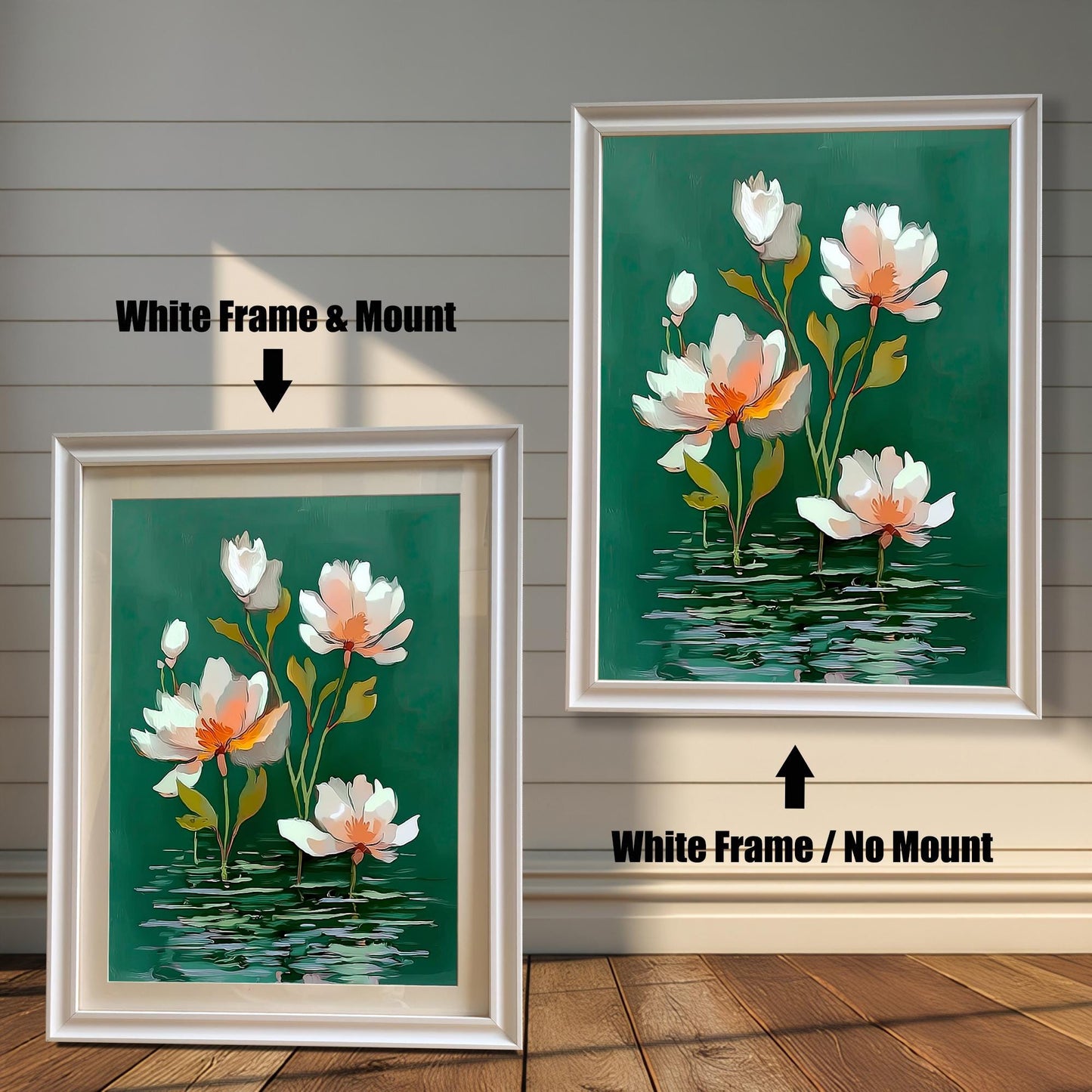 Abstract watercolor-style painting of white and pale orange water lilies on a dark green background. The image shows two framed options: one on the left with a White Frame & Mount (matting), and one on the right with a White Frame / No Mount. Both are displayed against a white wood-paneled wall and a wooden floor.
