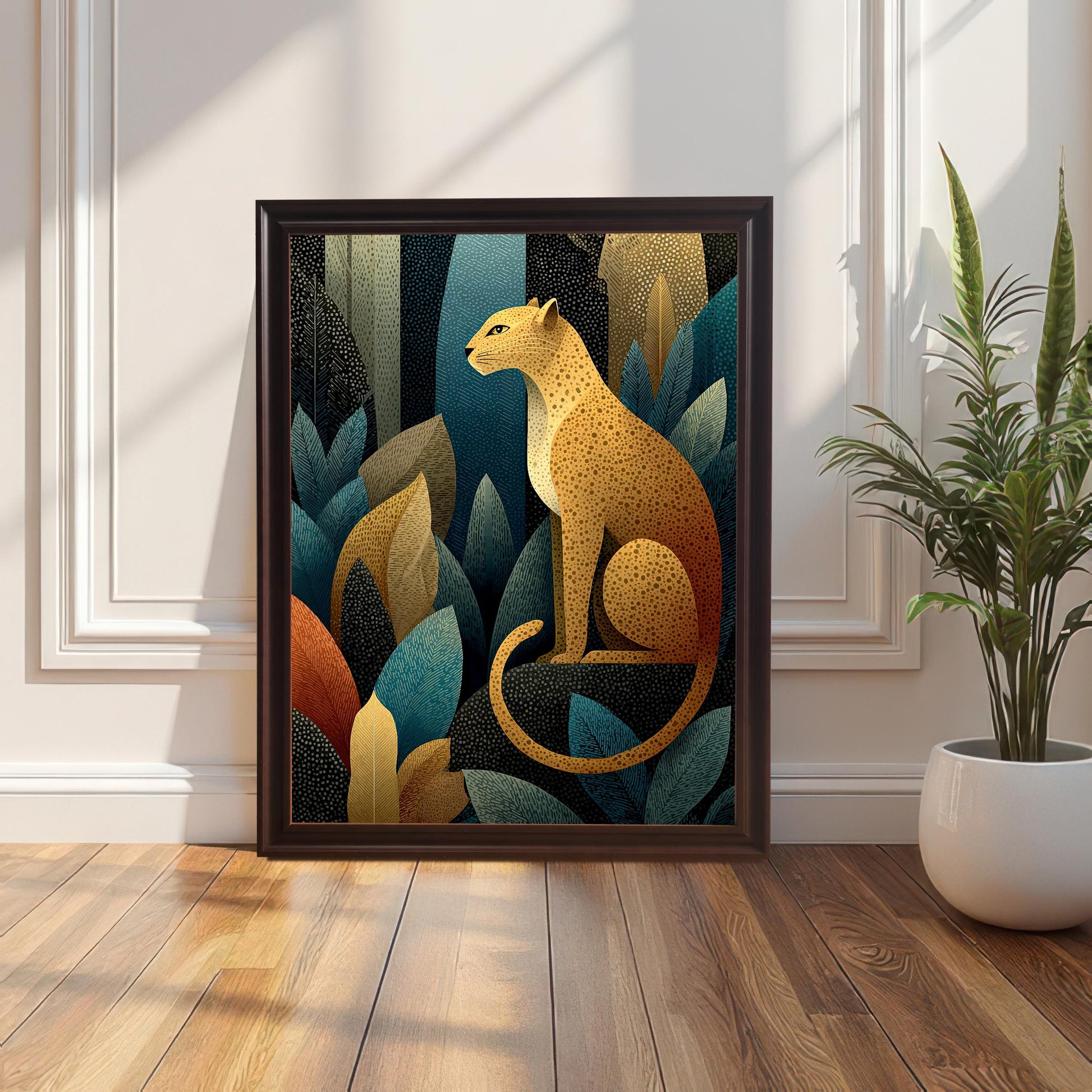 A framed art print of a golden leopard sitting among stylized jungle leaves, shown with a dark brown frame leaning on a wood floor next to a white wall panel and a potted snake plant.