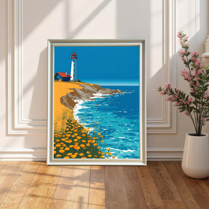 A framed art print of the lighthouse illustration, set in a White frame (no visible mount), leaning on a bright wooden floor against a white paneled wall, next to a white vase with pink flowers.
