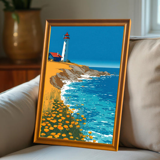 A framed art print of the lighthouse illustration, set in an Orange/Wood frame, leaning on a cream-colored sofa cushion.