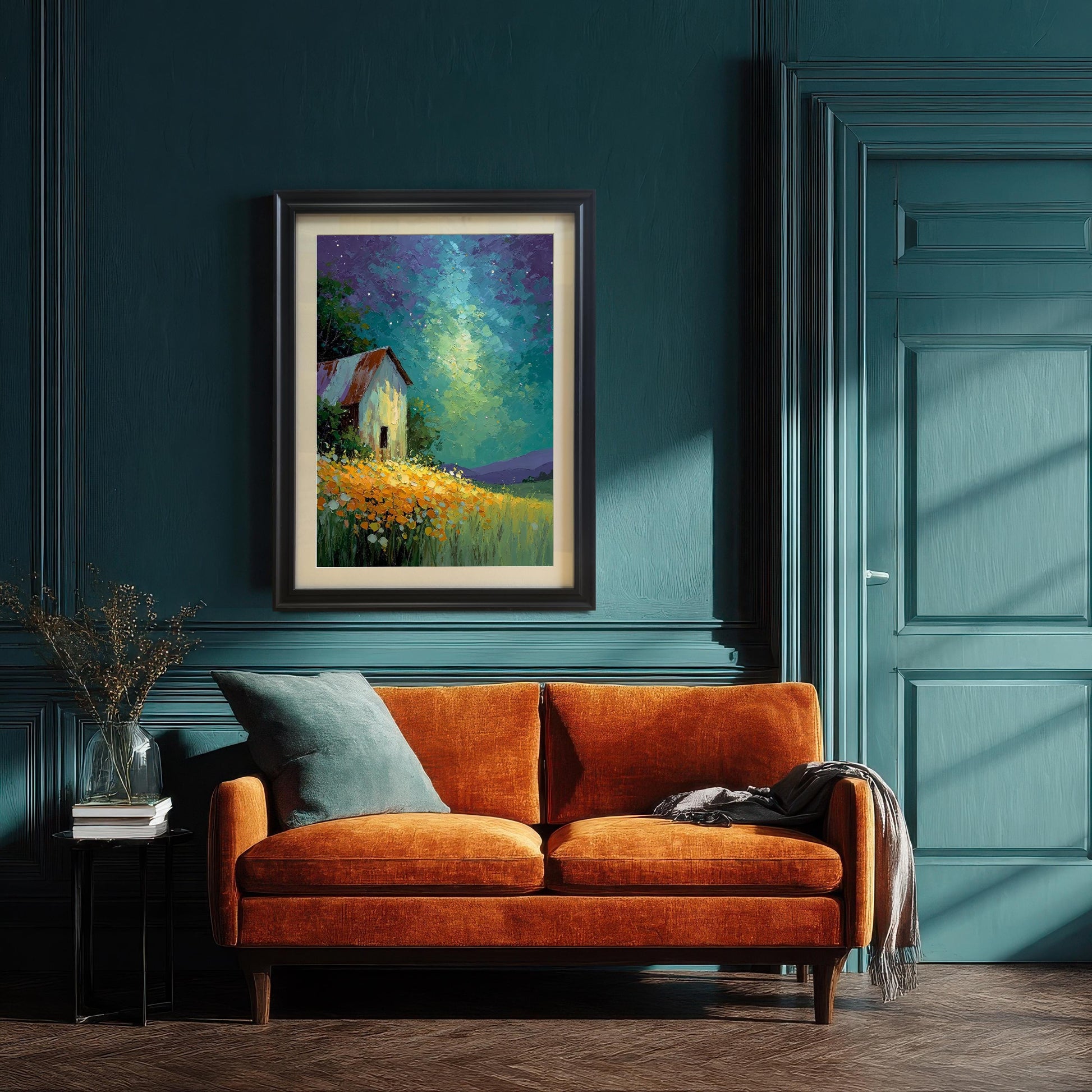 Painting of a barn under a vibrant, starry sky, framed in Black wood with a mat, hung above an orange velvet sofa against a paneled teal wall.