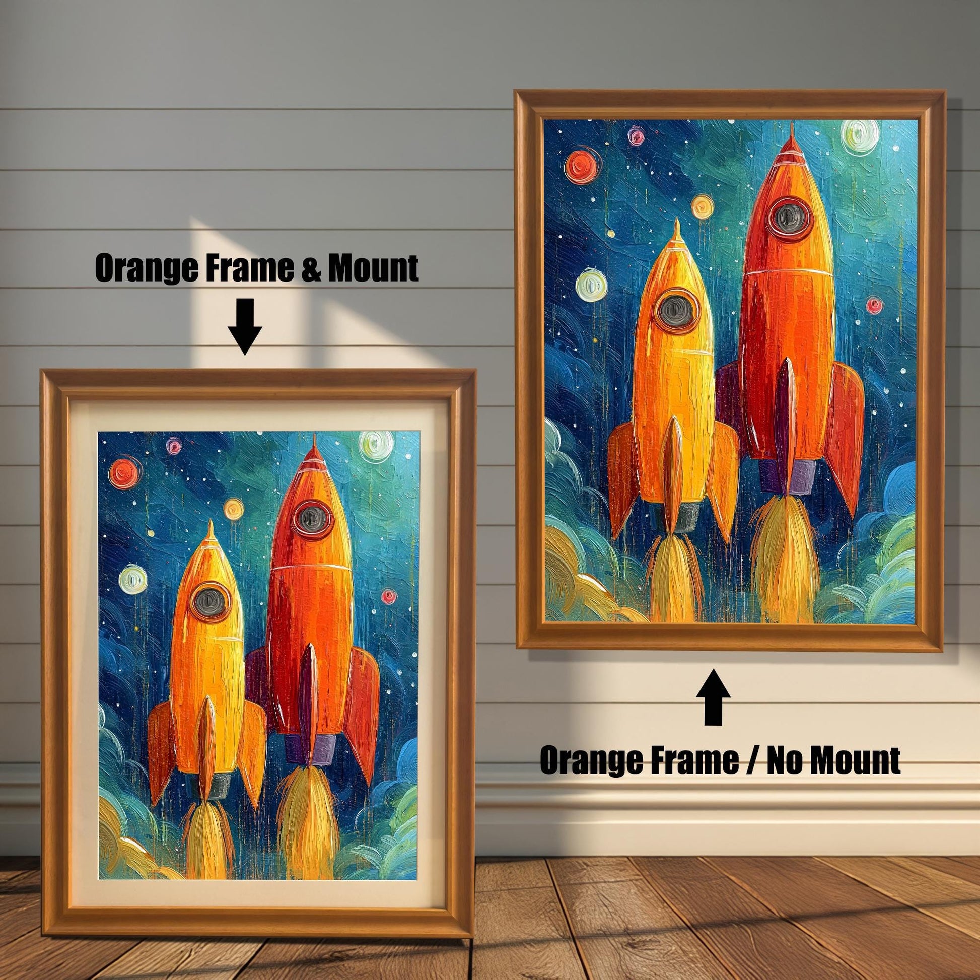 Two framed rocket prints on a white wood wall. One shows an Orange Frame & Mount (matting), and the other an Orange Frame / No Mount. Arrows highlight the difference.