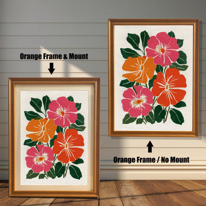 Two framed versions of the botanical print side-by-side against a white wooden wall. The image on the left, labeled "Orange Frame & Mount," has a reddish-brown frame and a light-colored mat (mount). The image on the right, labeled "Orange Frame / No Mount," has the same reddish-brown frame but no mat.