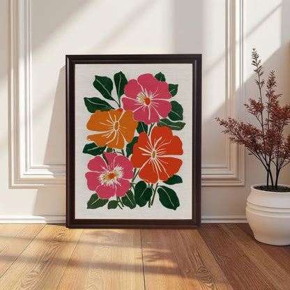 Framed print of bright, stylized flowers in pink, orange, and red with dark green leaves, leaning on a wood floor against white wainscoting next to a potted plant.