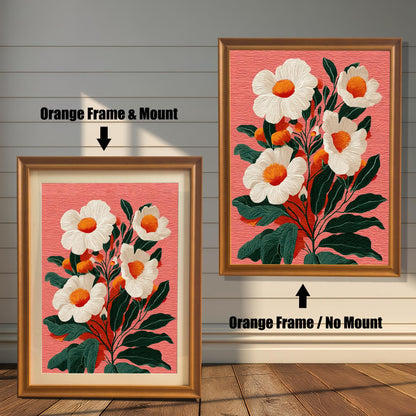Two versions of a floral print against a rustic wooden wall. The print features white flowers with orange centers on a salmon-pink background. On the left, a framed print with an orange frame and a mount. On the right, a framed print with an orange frame and no mount.