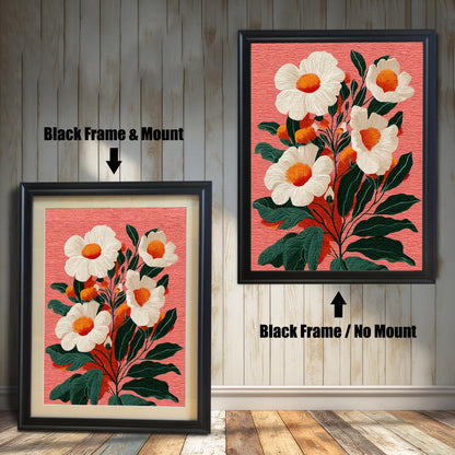 Two versions of a floral print against a rustic wooden wall. The print features white flowers with orange centers and dark green leaves on a textured salmon-pink background. On the left, a framed print with a black frame and a visible beige mount (mat). On the right, a framed print with a black frame and no mount.