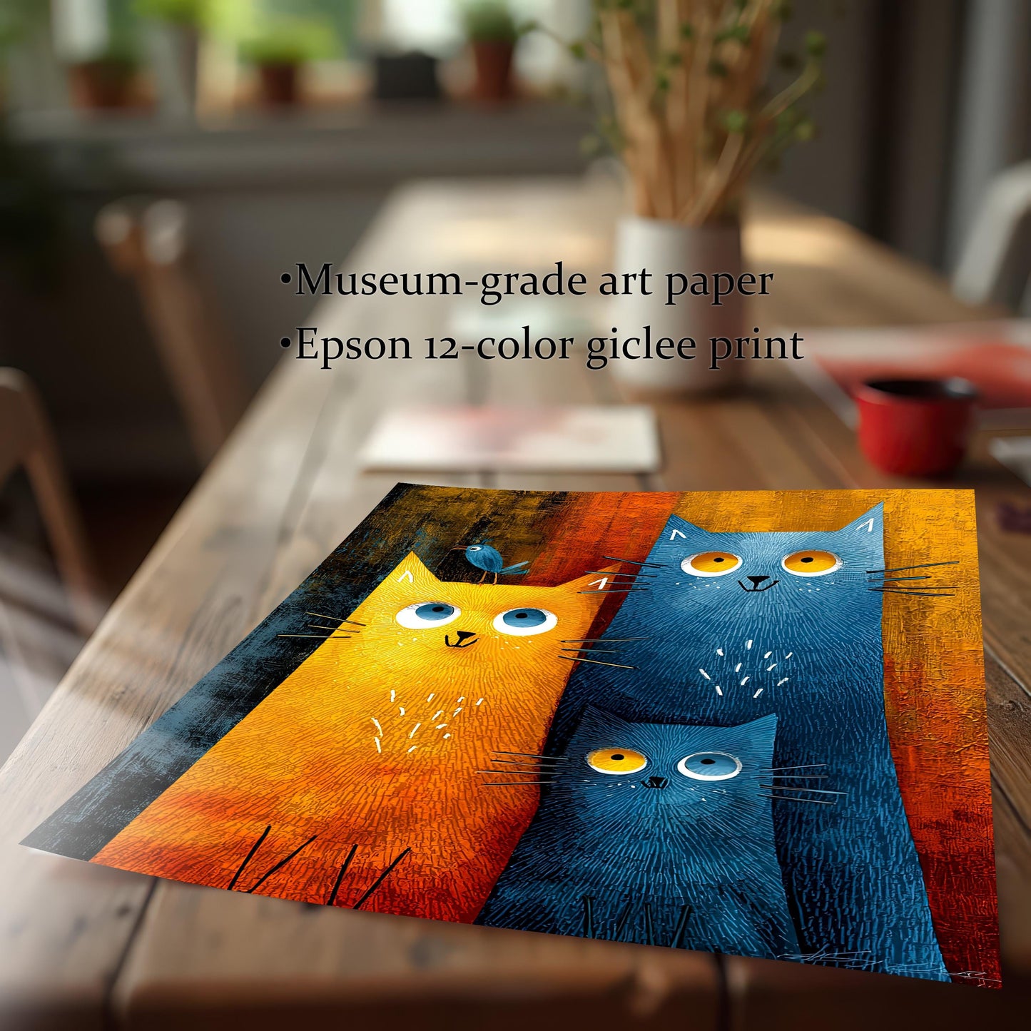 Close-up image of the corner of the cat family art print laid flat on a wooden table, emphasizing the texture and print quality. Text notes the use of Museum-grade art paper and an Epson 12-color giclee print.