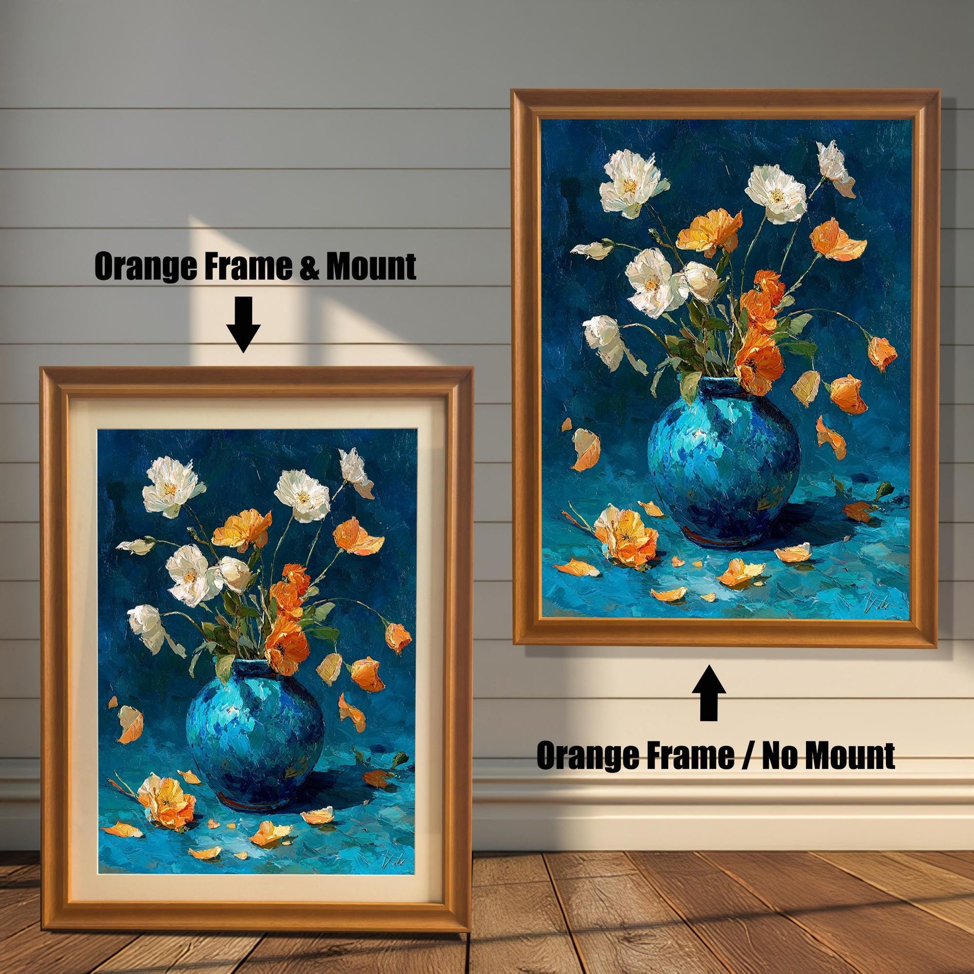 Two versions of the oil painting featuring white and orange flowers in a blue vase, set against a distressed white wood wall: one on the left in an Orange Frame & Mount (with a light-colored border), and one on the right in an Orange Frame / No Mount (without a border).