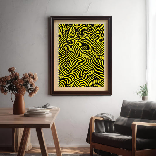 The abstract yellow and black striped print framed in a Coffee (dark brown) frame with a mount, hanging on a textured white wall above a wooden table and a dark leather armchair.