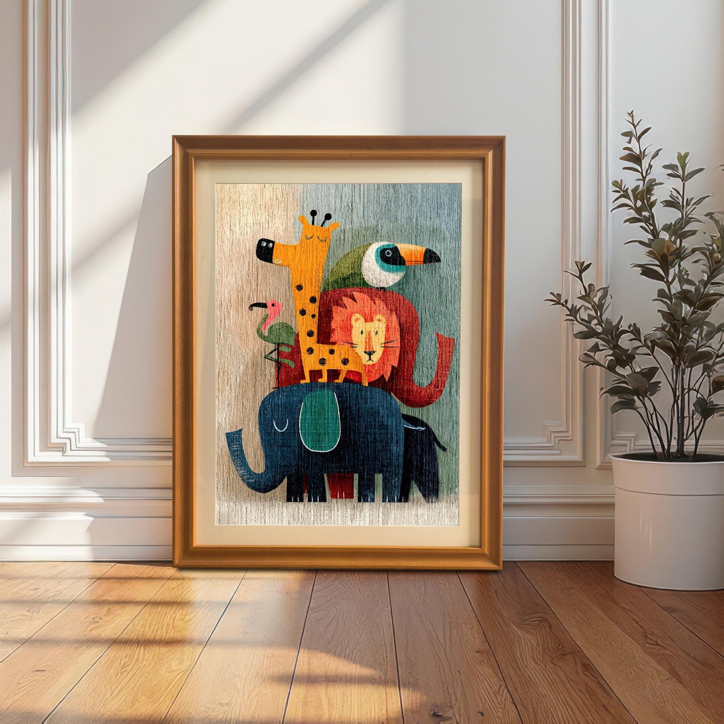 An orange-gold framed art print of the stacked cartoon animals with a mount, leaning against a white wainscoting wall, next to a potted plant.