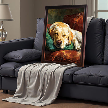 A dark brown-framed painting of a sleeping Labrador on a couch, propped up on a gray sofa draped with a beige blanket.
