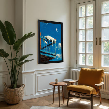 A black-framed painting of a white cat sleeping on a blue balcony railing, hanging on a white wall in a corner reading nook with an orange chair and large plant.