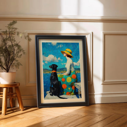 A framed painting of a woman and her dog by the water, resting on a wooden floor against a white wall with wainscoting.