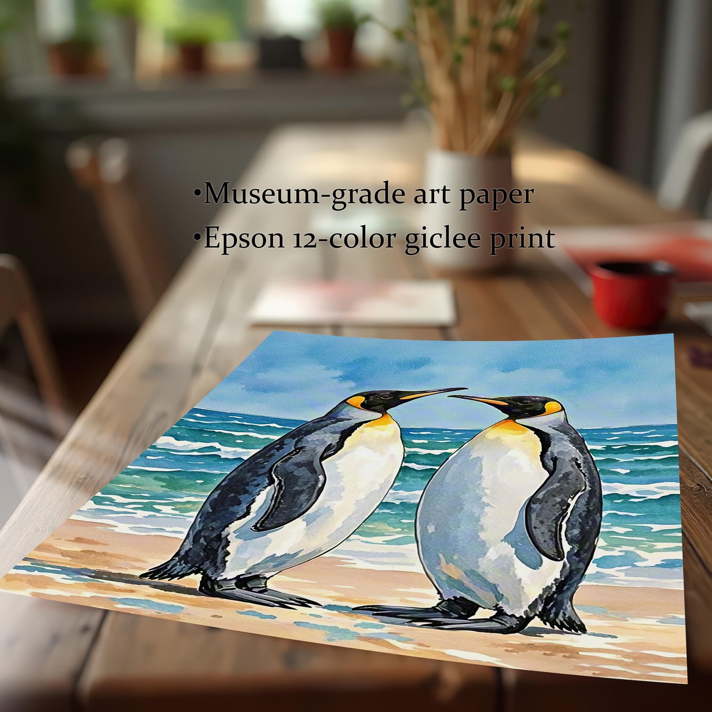 Close-up of a watercolor penguin art print on a wooden table, with text: "Museum-grade art paper" and "Epson 12-color giclee print."