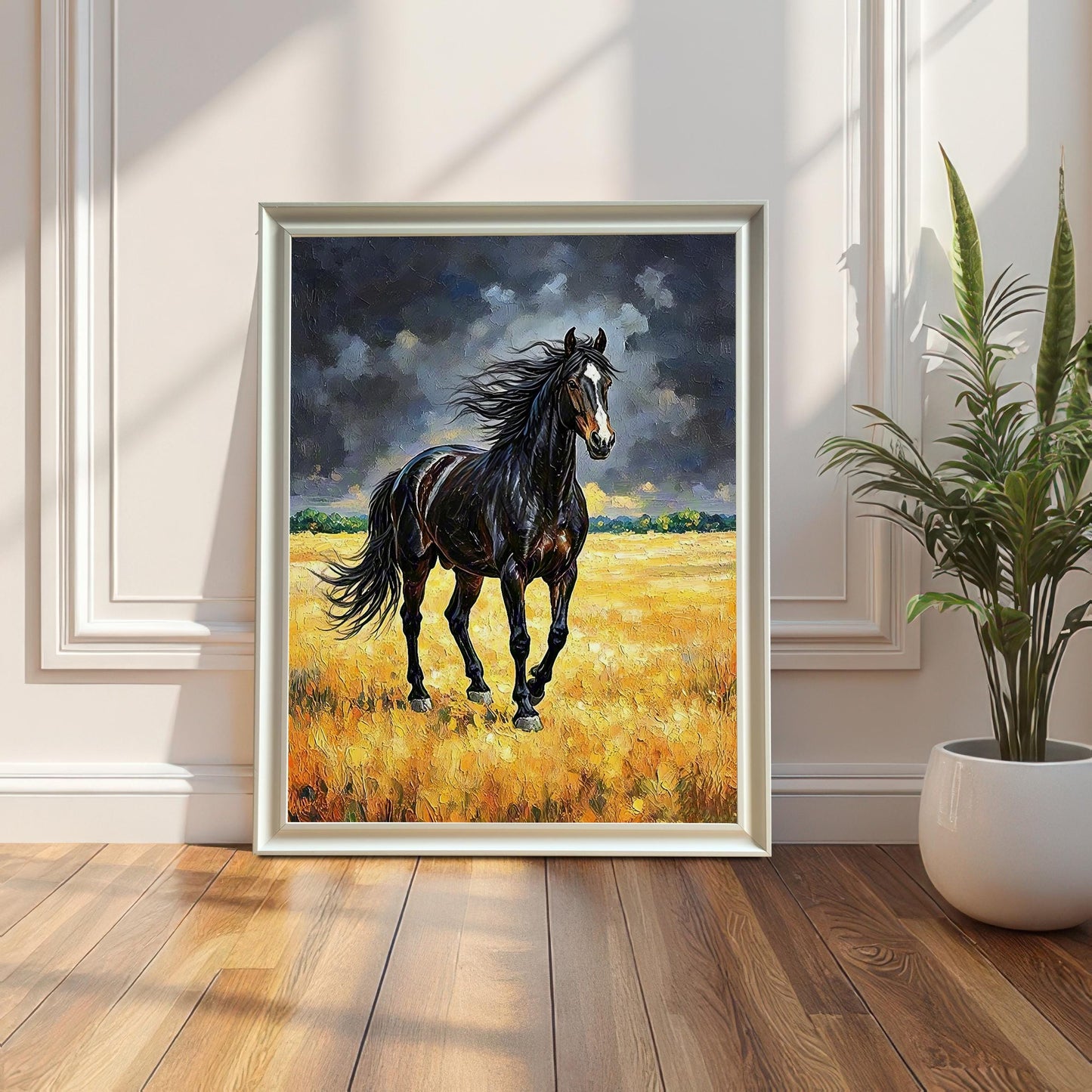 White-framed oil painting of a black horse in a golden field, leaning against a white paneled wall next to a potted snake plant.