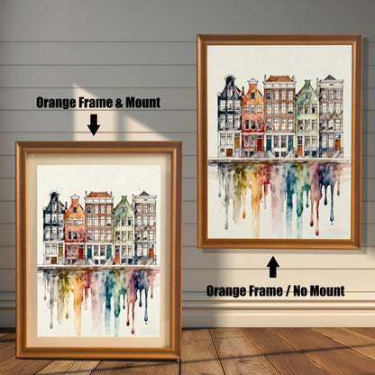Comparison image showing the watercolor cityscape print in an Orange Frame & Mount (with a beige border/mat) on the left, and an Orange Frame / No Mount (without border) on the right.