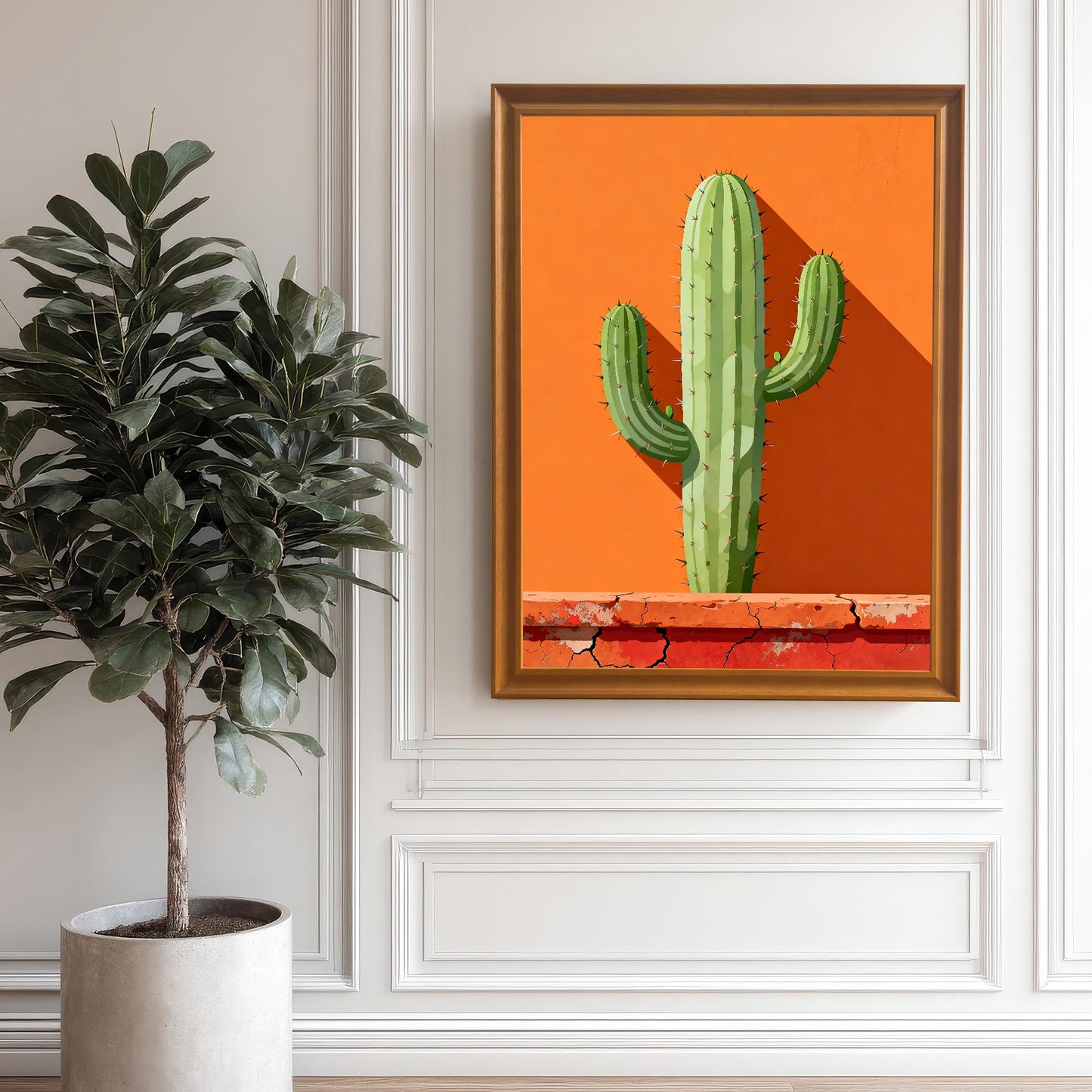 Large framed cactus art in an Orange wood frame hanging on a white paneled wall next to a large potted fig tree, emphasizing the modern desert aesthetic.