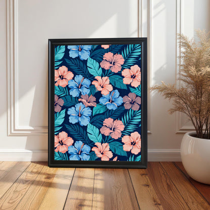 Single framed hibiscus pattern art in a Black frame leaning on a wooden floor against a white paneled wall, next to a potted dried arrangement.