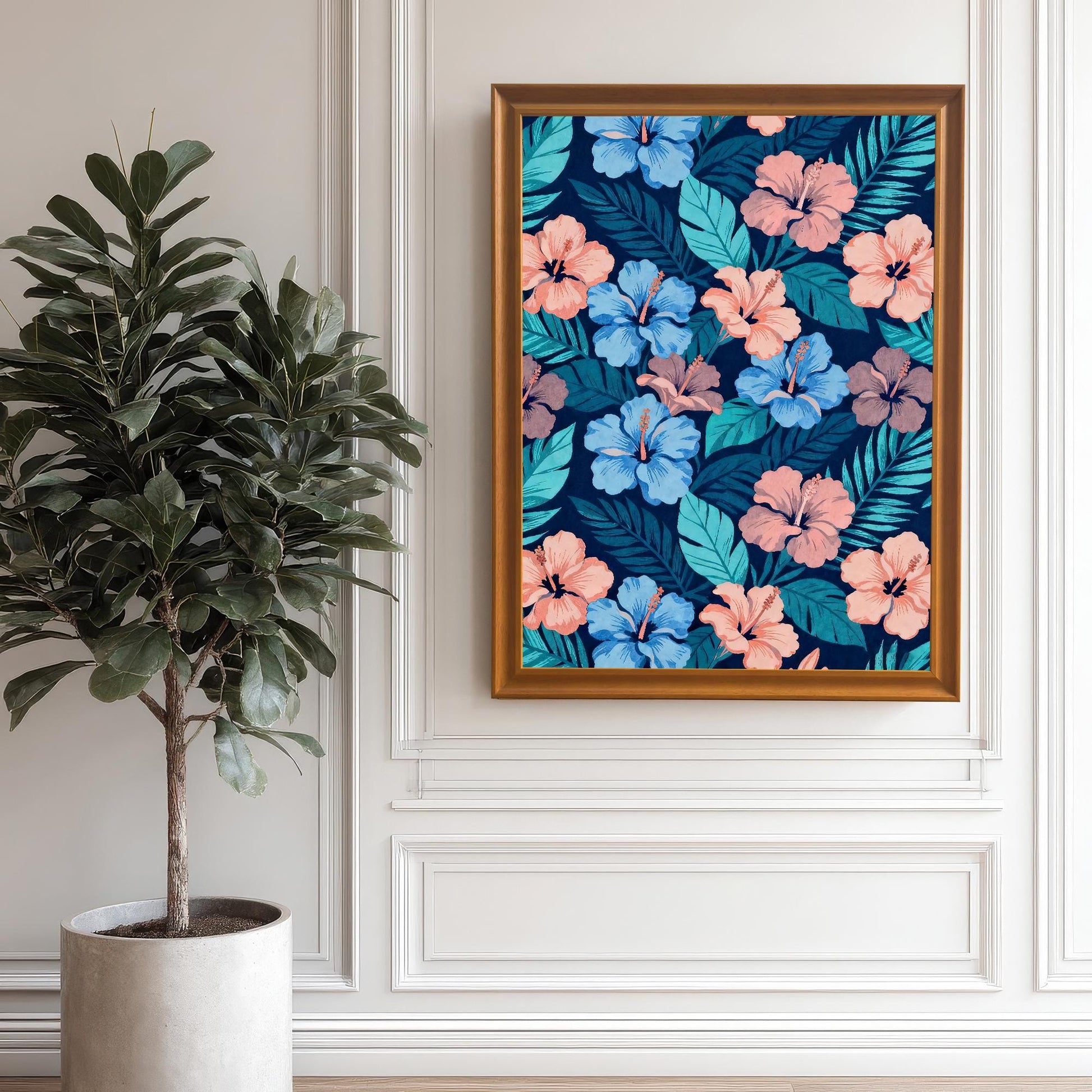 Framed tropical hibiscus art in an Orange wood frame hanging on a white paneled wall next to a large potted plant, showcasing the vibrant colors.