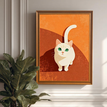 Vertical framed art print of a stylized white cat with a long tail and striking green eyes, looking up. The cat is centered against a warm, two-toned orange and rust-brown background. The frame is a warm wood (Orange/Coffee), hung on a white wainscoting wall next to a large potted plant.