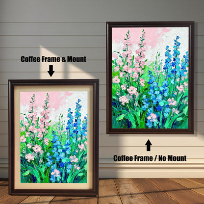 Abstract floral art print featuring pink and blue flowers, shown in two framed options: a Coffee Frame with a Mount (lighter border/mat) on the left, and a Coffee Frame with No Mount on the right.