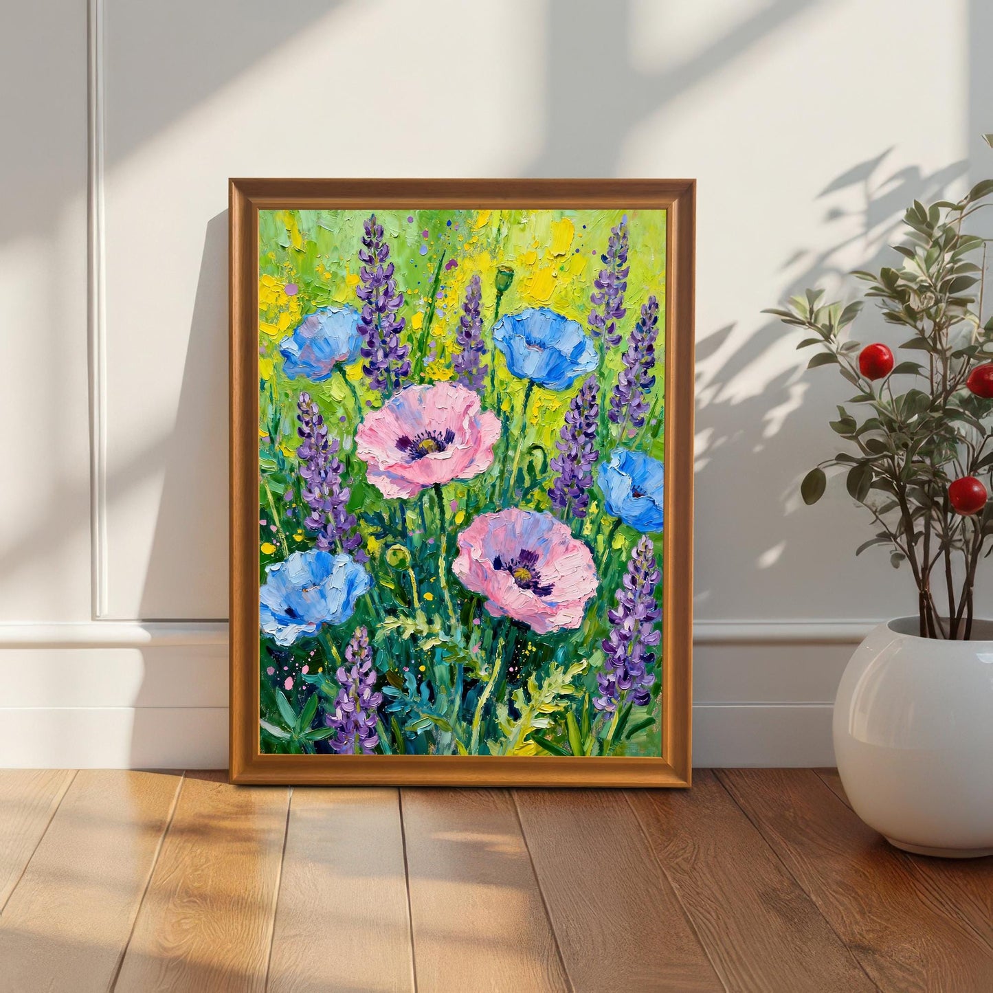 Styled photo of the poppy and lavender art print in an Orange/Brown wood frame, leaning against a white wall next to a houseplant, illuminated by natural light.