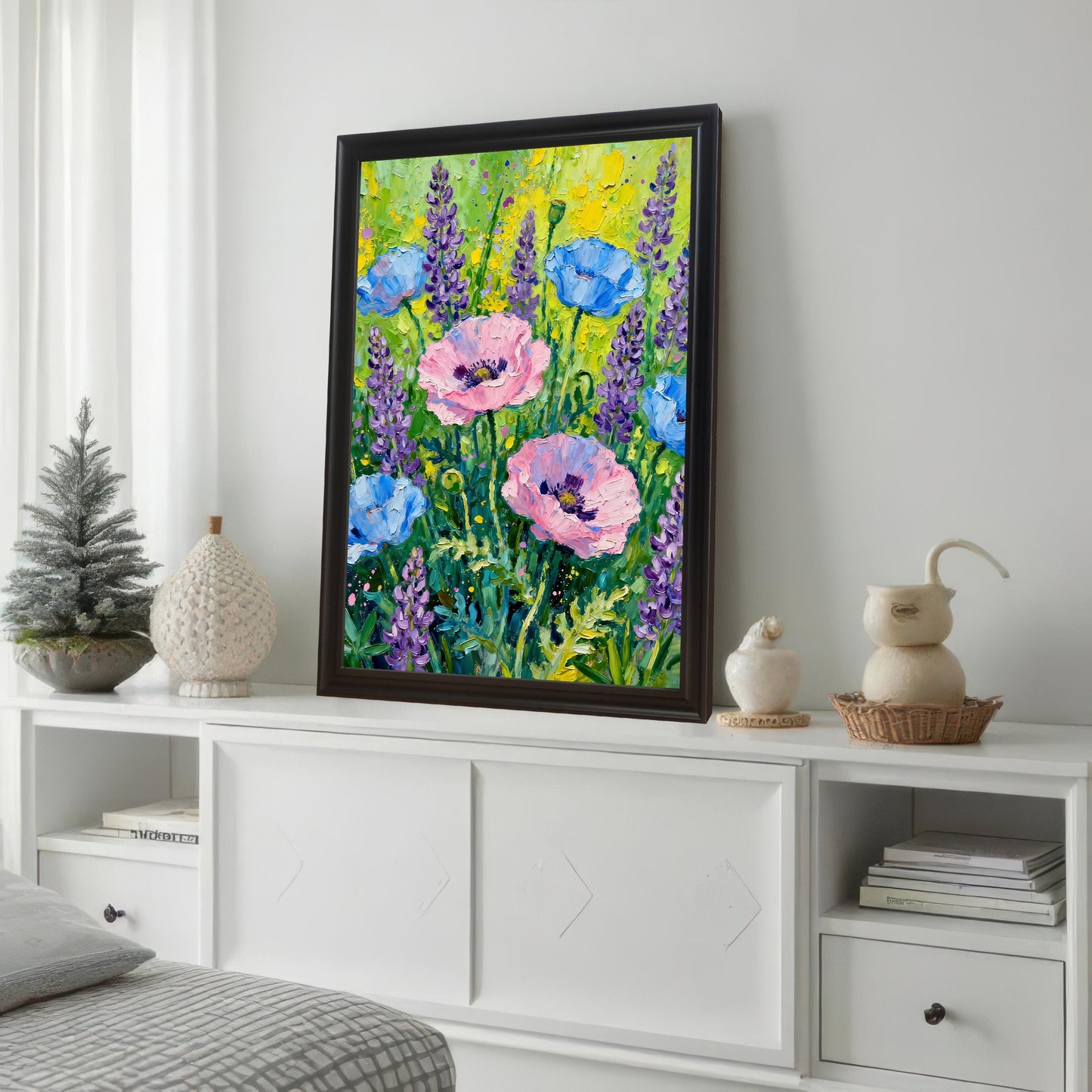 Styled photo of the poppy and lavender floral art print in a Dark/Coffee frame with a mount, displayed on a white console table in a bright room next to decorative items and a small Christmas tree.