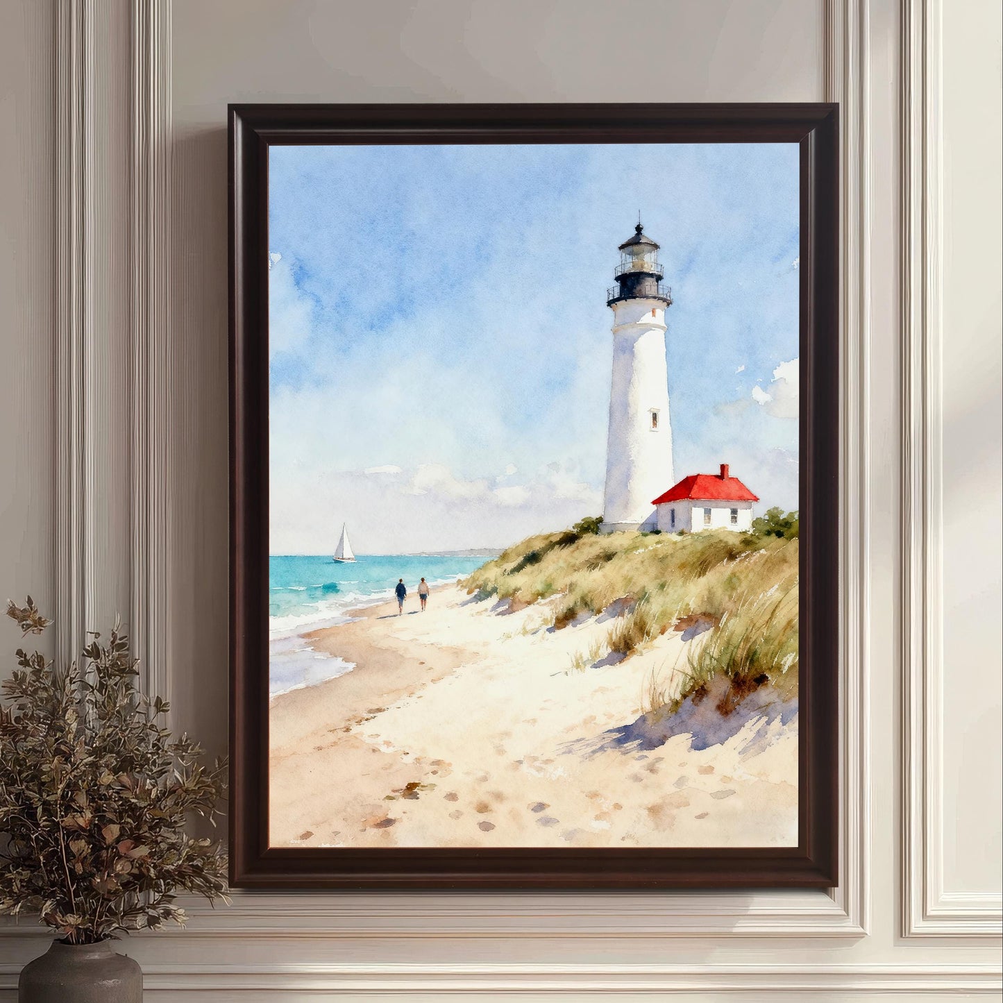 Close-up lifestyle photo showing a large framed art print of a lighthouse on a beach leaning against a decorative white wall. The frame is a dark, possibly black or coffee, color.