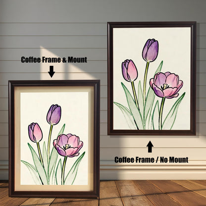 Comparison of two framed art prints on a wall. On the left, a watercolor-style print of pink and purple tulips in a framed with a Coffee Frame & Mount (matting). On the right, the same art print with a Coffee Frame / No Mount. Arrows indicate the frame/mount options.