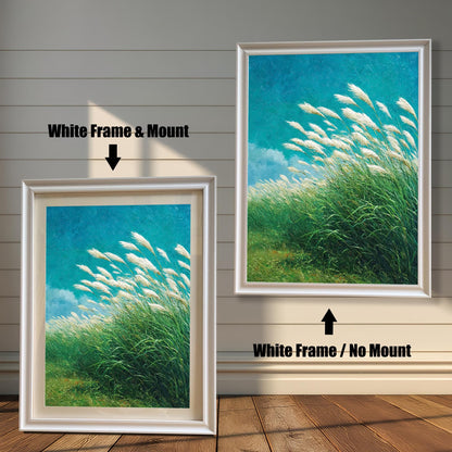 Comparison of two framed art prints on a wall. On the left, a windy grass field print in a framed with a White Frame & Mount (matting). On the right, the same print with a White Frame / No Mount. Arrows indicate the frame/mount options.