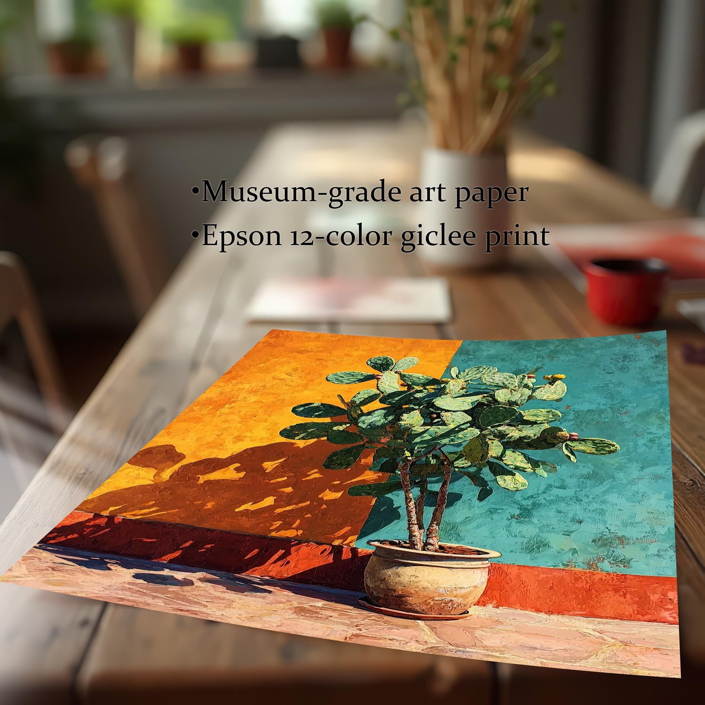 Close-up view of the unframed cactus art print lying on a wood table. Text highlights the print quality: Museum-grade art paper and Epson 12-color giclee print.