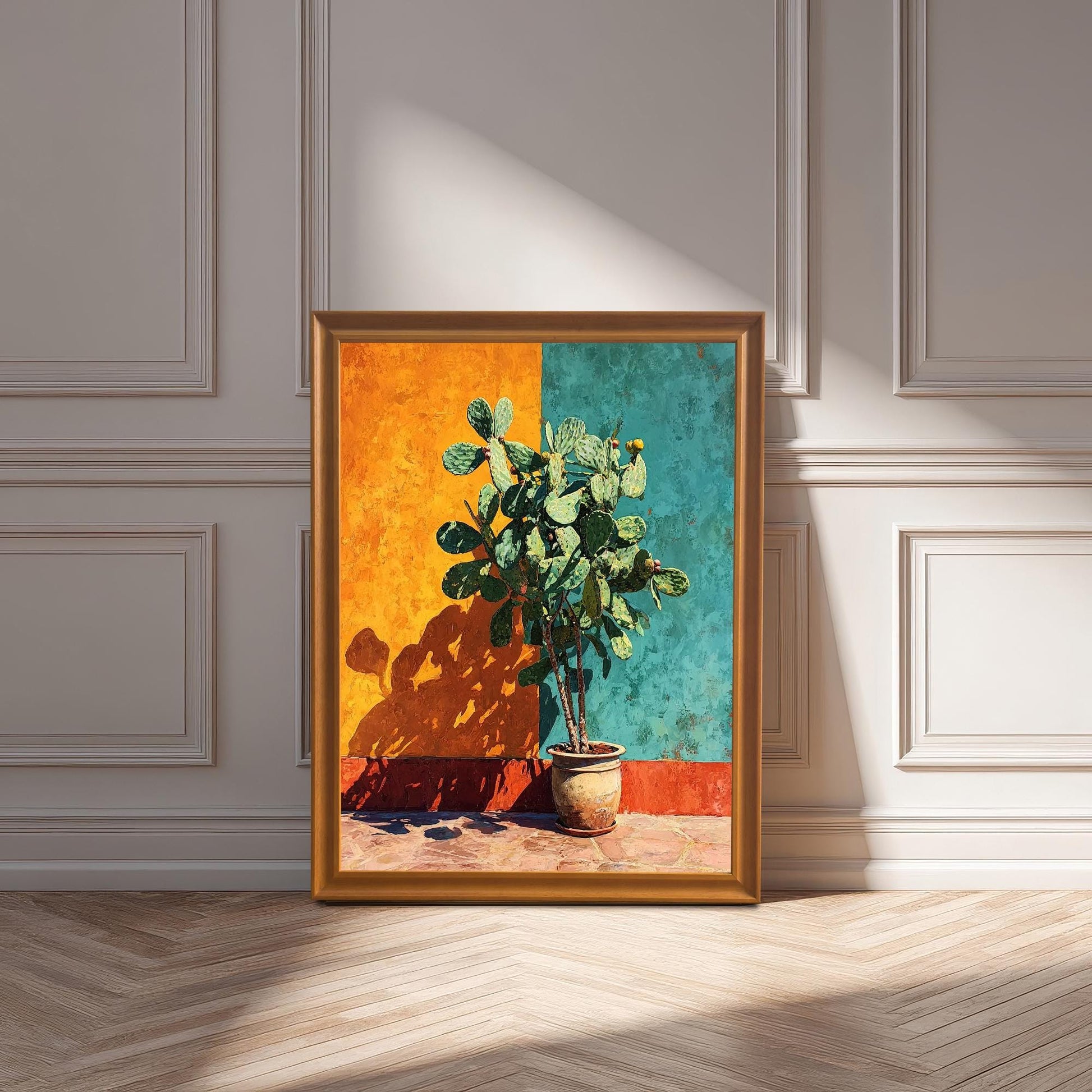 The cactus art print displayed in an Orange Frame leaning on a light-colored wood floor against a white wainscoted wall, shown in bright sunlight.