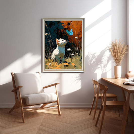 A framed art print of a white cat looking up at a blue butterfly, hanging on a light wall in a sunlit modern dining and sitting area.