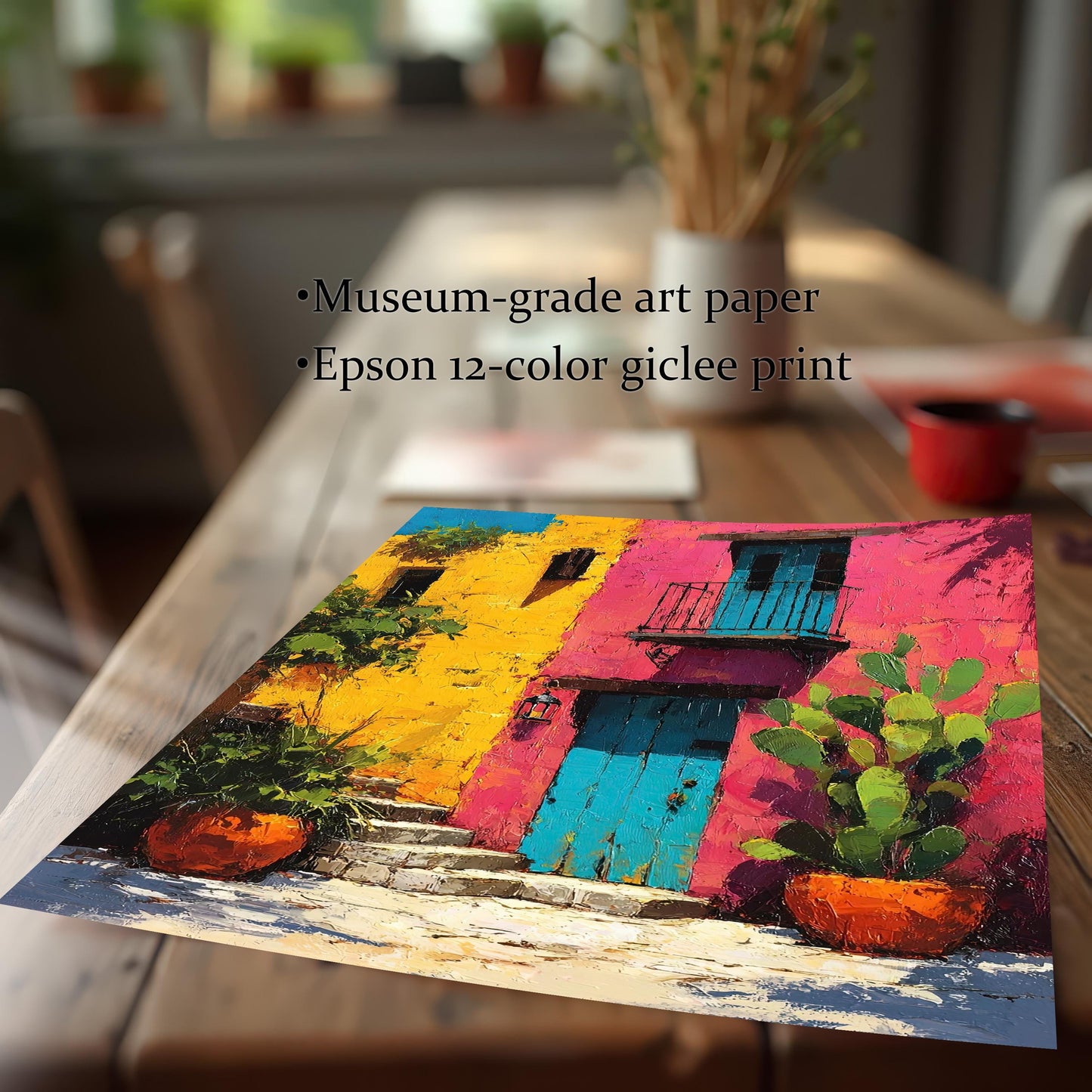 Close-up angled view of the colorful architectural print on a wooden table, highlighting the thick texture and details of the Museum-grade art paper and Epson 12-color giclee print quality.
