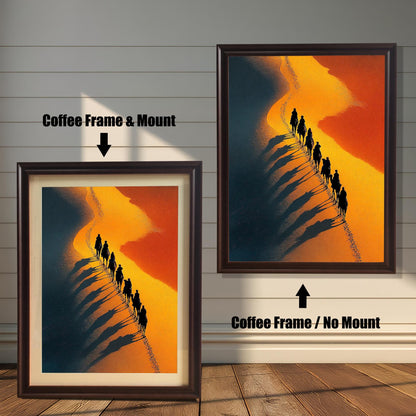 Dramatic desert art print featuring a camel caravan silhouette traveling along a golden dune, casting long dark shadows. Comparison shot: Coffee Frame & Mount (with white border/mat) on the left, and Coffee Frame / No Mount (without border/mat) on the right.