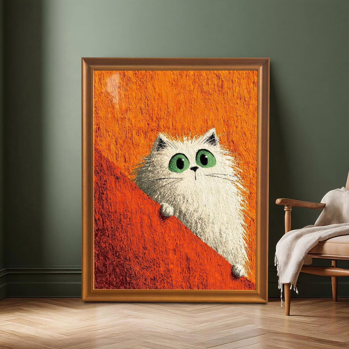 Large framed print of the white cat in a Coffee-colored wood frame resting on a wood floor against a dark green wall, next to a modern armchair.