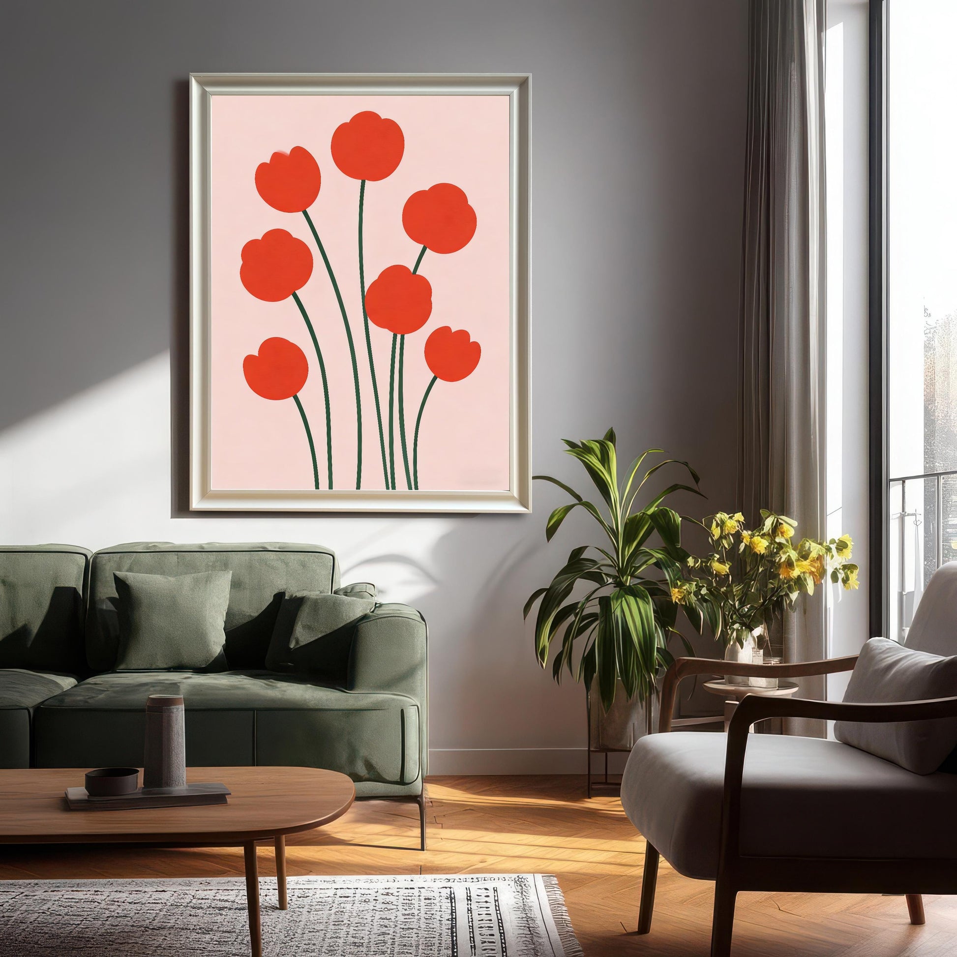 Large framed print of the modern red flower illustration hanging on a light grey wall in a living room setting with a green sofa and plant. The frame is White-colored wood.